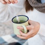 Woman Steeping Tea Bag