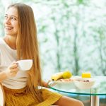 Woman Holding Tea at Breakfast