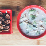 Overnight Oats and Walnuts on a Cutting Board