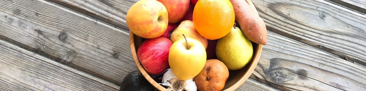 Bowl of Fruit on Wood Floor