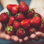 Person Holding Strawberries