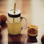 Electrolyte Drink and Oranges on a Table