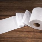 Toilet Paper on Wood Floor