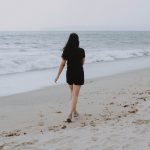 Woman Walking on Beach